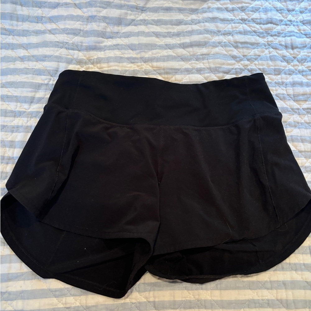 Black Lululemon size four tall shorts